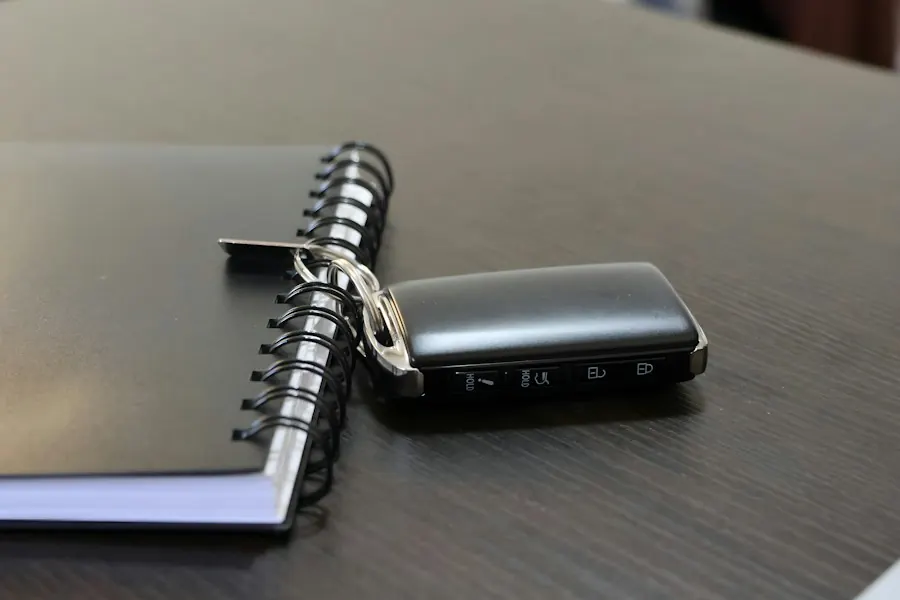 Car key resting on a notebook